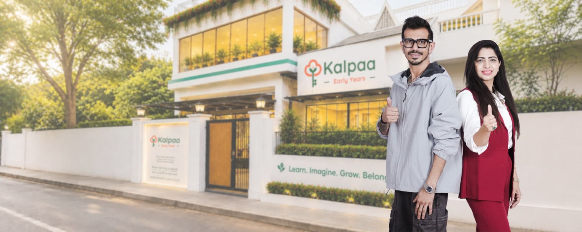 Yuzvendra Chahal and a colleague giving a thumbs-up outside a Kalpaa Early Years centre
